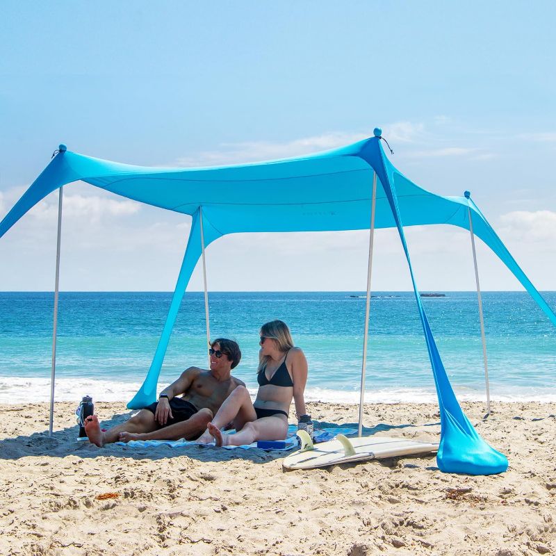 Photo 1 of AMMSUN Beach Tent Portable Sun Shelter,9X 9ft Beach Canopy Easy Setup, 9'x9'Lycra Sun Shelter with UPF50+ Protection 4 Sand Bags & 4 Aluminum Poles for Family at The Beach, Camping & Outdoor
