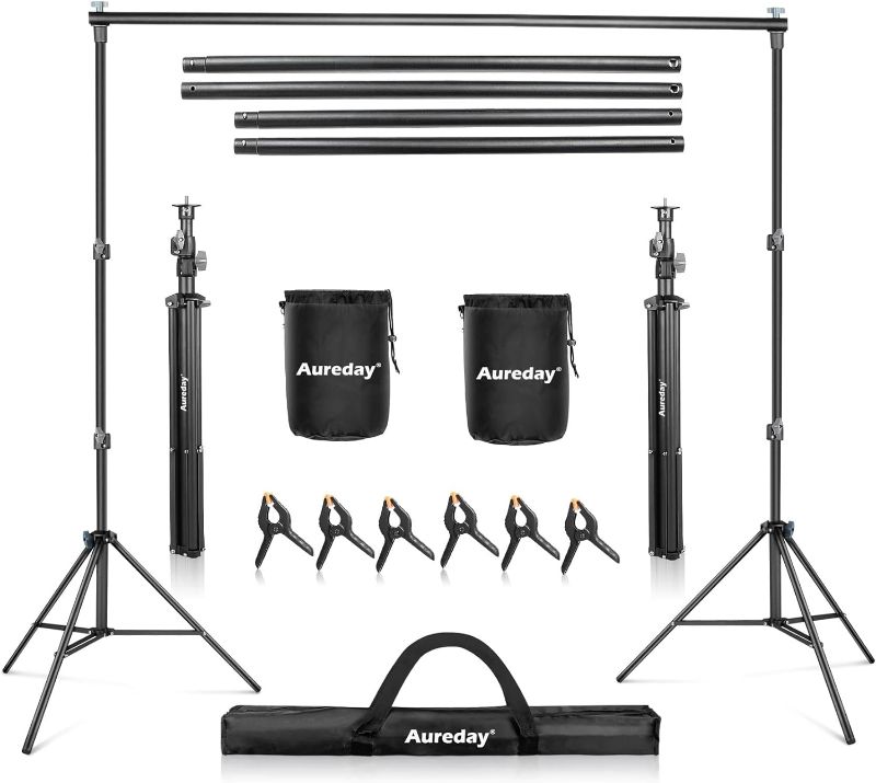 Photo 1 of Aureday Backdrop Stand, 8.5x10Ft Adjustable Photo Backdrop Stand Kit with 4 Crossbars, 6 Background Clamps, 2 Sandbags, and Carrying Bag for Parties/Wedding/Photography/Festival Decoration