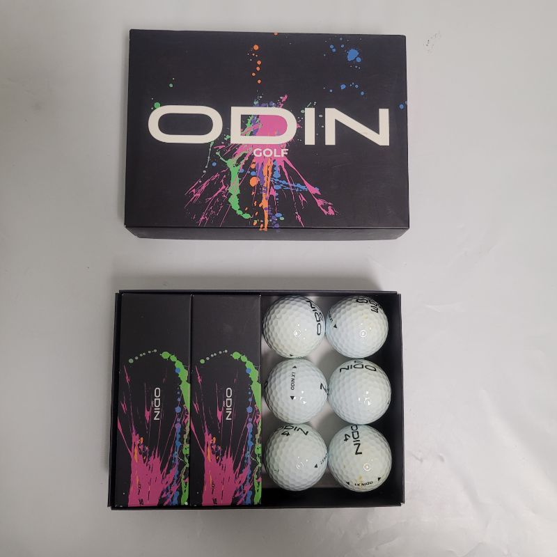 Photo 1 of ** Single  TEST ON PARTIAL SET ** The ODIN X1 Golf Ball fits all your needs of a premium tour-level ball without denting your wallet. It consists of a 3-piece urethane cover construction that gives you a great low driver spin and a high wedge spin to maxi