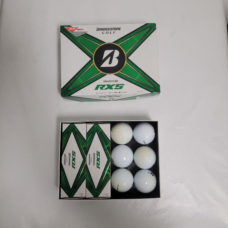 Photo 1 of ** SINGLE HIT TEST ON PARTIAL SET ** Upgrade your balls to fly like the pros' with the Bridgestone Golf 2024 Tour B-RXS Golf Balls 12-Pack. The urethane core offers a faster velocity, and the polybutadiene cover increases speed and spin for better flight 