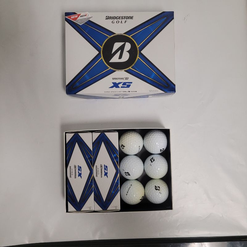 Photo 1 of ** Single  TEST ON PARTIAL SET ** Maximize your performance with the Bridgestone Golf 2024 Tour B-XS Golf Balls 12-Pack. The 3-piece design enhances spin for accuracy, while Reactiv X technology delivers intense rebound for long-distance flights.