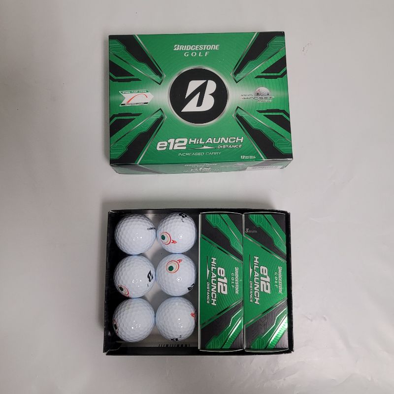 Photo 1 of ** Single  TEST ON PARTIAL SET **  Start achieving hole in ones with the Bridgestone Golf E12 Hi-Launch Golf Balls 12-Pack. Its Mindset technology offers a visual cue on the golf ball that reminds you of the easy 3-step process. The 2-piece construction p