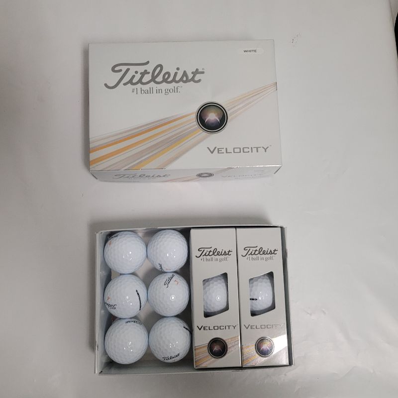 Photo 1 of ** Single  TEST ON PARTIAL SET ** Go for the green when you use the Titleist 2024 Velocity Golf Balls 12-Pack. The 2-piece construction creates improved flying and spinning speeds, and the 350 octahedral spherical-tiled dimple count helps increases the tr