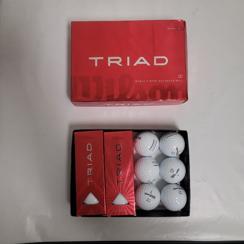 Photo 1 of ** Single  TEST ON PARTIAL SET **  The New & Improved Wilson Triad Golf Ball is a soft three-piece urethane golf ball that offers performance benefits to help the aspiring golfer find more fairways, attack more pins and sink more putts. The patented Tri-B