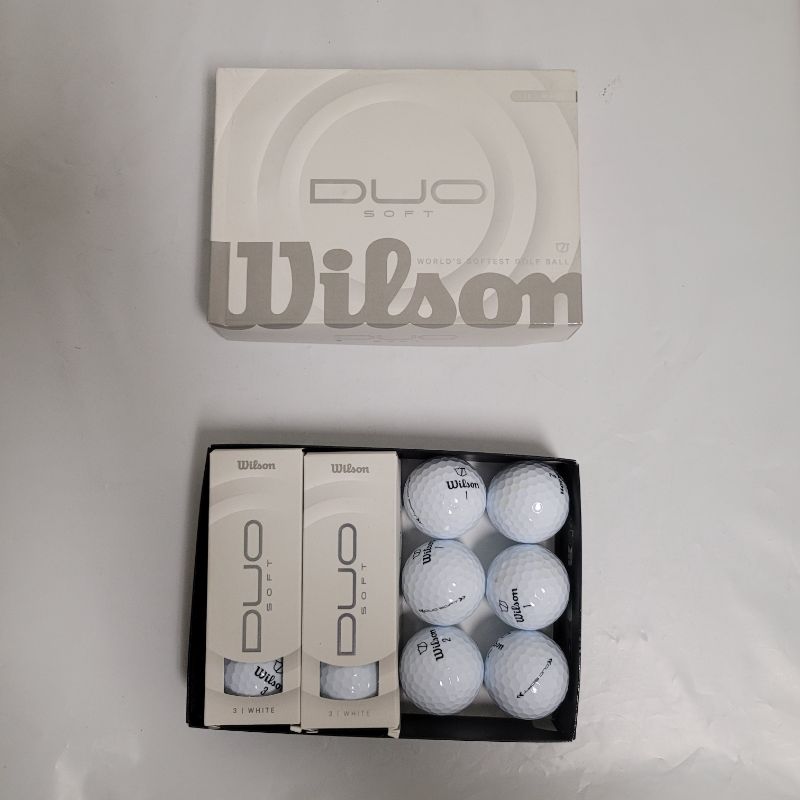 Photo 1 of ** Single  TEST ON PARTIAL SET **  Practice for hole in ones with the Wilson Duo Soft Golf Balls 12-Pack. Its surlyn cover resists scuffs. The 2 layer construction reduces spin on longer shots, and its 37 compression rating helps golfers with slower swing