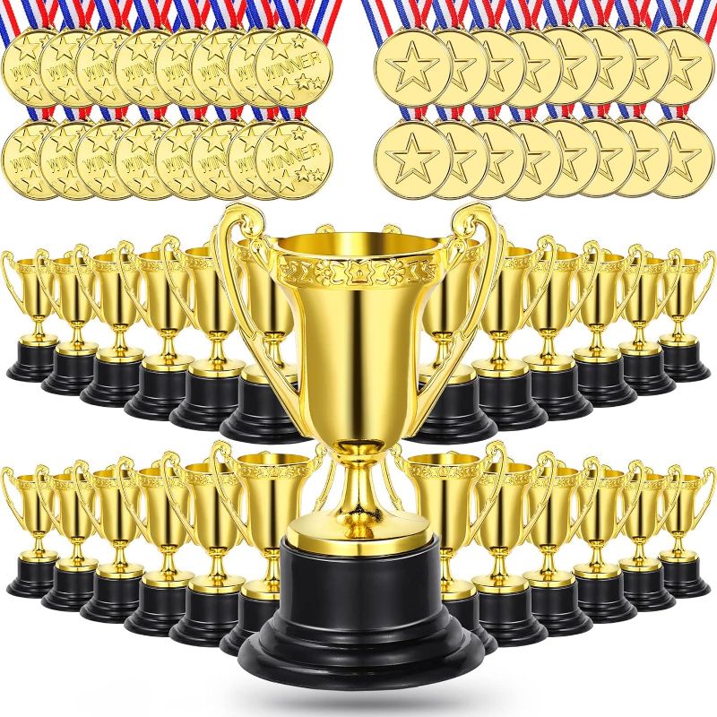 Photo 1 of Fumete 96 Pcs Mini Trophies and Medals Set Includes 3.34'' Gold Plastic Trophy Cup and 1.4'' Winner Medals for Kids and Adults Party Favors School Sports Events Prize Competition
