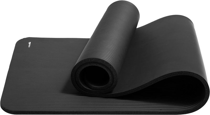 Photo 1 of Amazon Basics Extra Thick Exercise Yoga Gym Floor Mat with Carrying Strap - 74 x 24 x .5 Inches, Black 