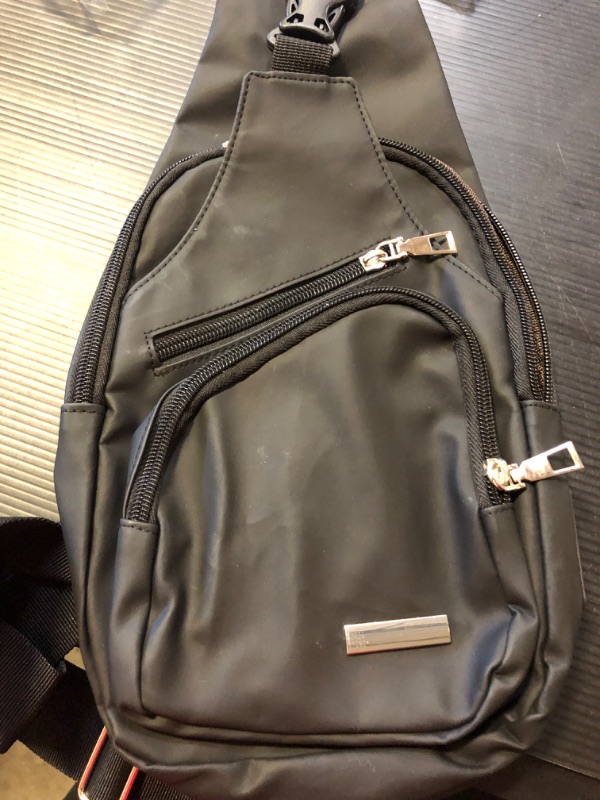 Photo 1 of black leather cross body bag