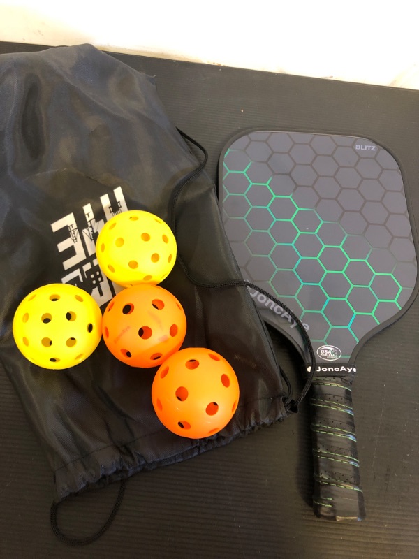 Photo 1 of Pickleball Paddle and Balls