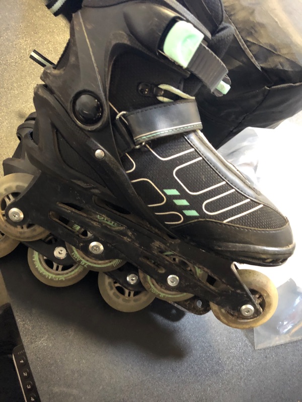 Photo 1 of ROLLER BLADES TEAL AND BLACK US 9 
