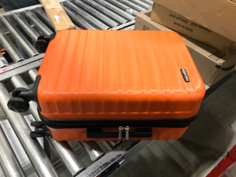 Photo 2 of AmazonBasics Hardside Luggage with Spinner Wheels, Orange, Carry-On 20-Inch Carry-On 20-Inch Orange