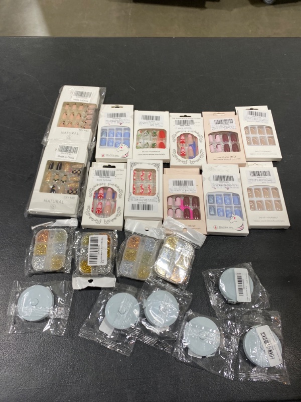 Photo 1 of 22 PCS BAG LOT- PRESS ON NAILS, TAPE MEASURE, NAIL ART GLITTER