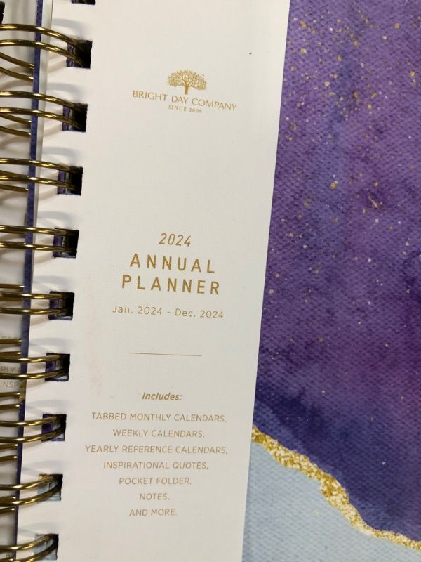 Photo 2 of 2024 Purple Annual Planner by Bright Day, Yearly Monthly Weekly Daily Spiral Bound Dated Agenda Flexible Cover Tabbed Notebook, 8.25 x 6.25