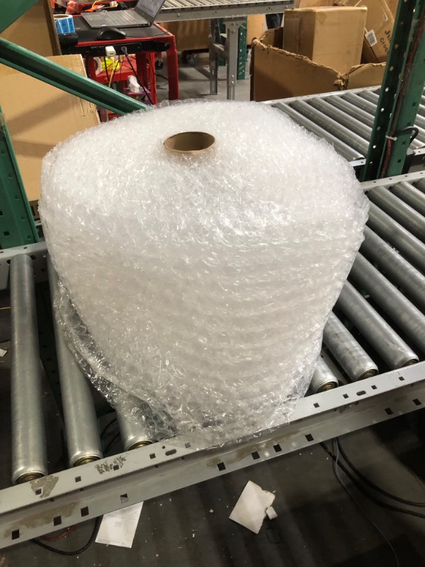 Photo 2 of **LARGE BUBBLE** Amazon Basics Perforated Bubble Cushioning Wrap, Small 3/16", 12-Inch x 175 Foot Long Roll, Clear