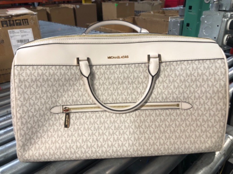 Photo 2 of **STOCK IMAGE IS A REFERENCE ONLY**  Michael Kors Travel Large Duffle Bag in PVC Signature (WHITE)