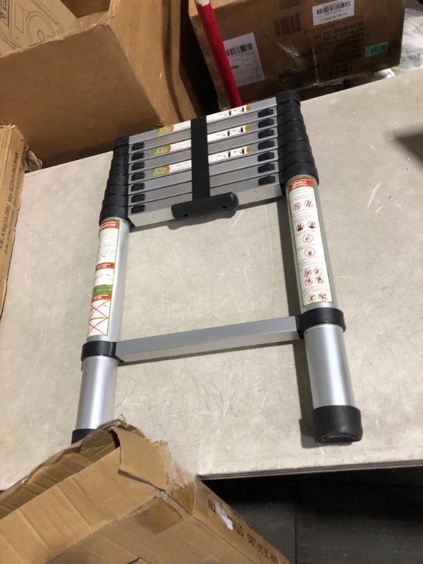 Photo 2 of ***USED - LIKELY MISSING PARTS - UNABLE TO VERIFY FUNCTIONALITY***
Soctone Telescoping Ladder, 12.5 FT Aluminum Button Retraction Extension Ladder with 2 Triangle Stabilizers, Multi-Purpose Ladder with Slow Down Design, 330lbs Max Capacity for House Daily