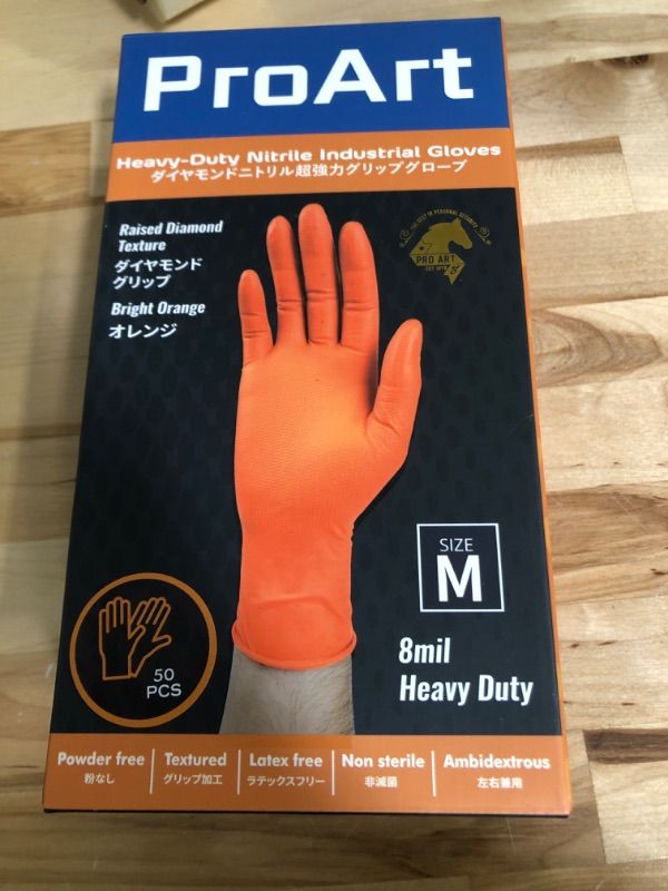 Photo 1 of 8 mil nitrile gloves MEDIUM ORANGE