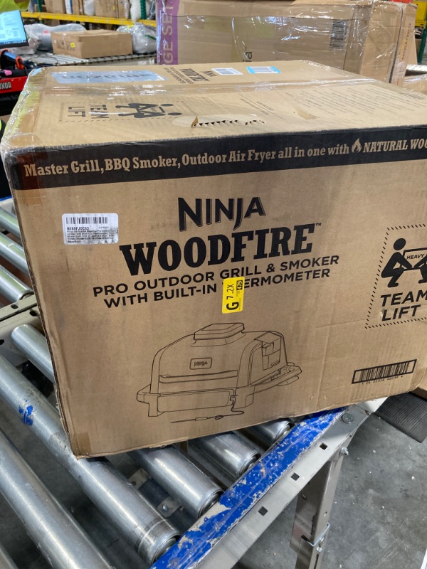 Photo 1 of Ninja OG751 Woodfire Pro Outdoor Grill with Built-In Thermometer, 7-in-1 Master Grill, BBQ Smoker, & Outdoor Air Fryer Plus Bake, Roast, Dehydrate & Broil, Woodfire Technology, Weather-Resistant, Grey Smart Thermometer + Woodfire Grill