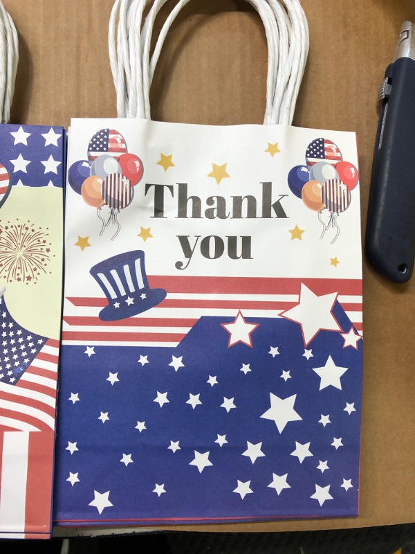 Photo 2 of 12 Pcs Patriotic Gift Bags with Handle with 24 Red Blue White Tissue Paper and Stickers, USA Flag Paper Gift Bags Party Candy Favor Bags Goodie Treat Bags for Veterans Day 4th of July Independence Day Party Supplies
