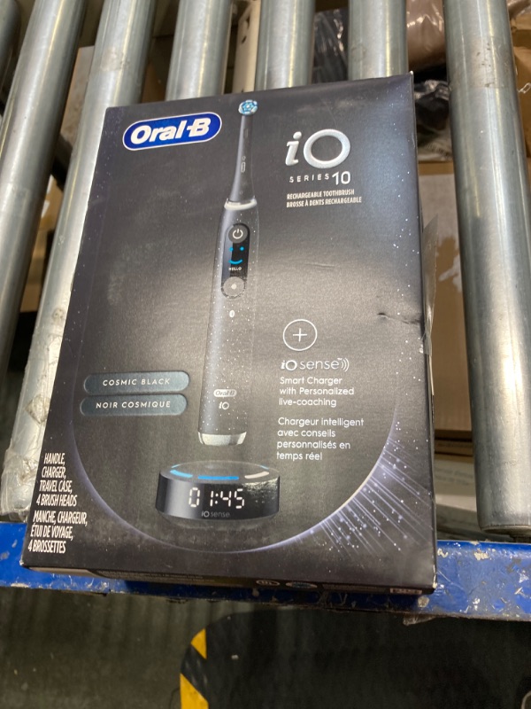 Photo 1 of ***PARTIALLY FUNCTIONAL//SOLD AS PARTS*** 
Oral-B iO Series 10 Rechargeable Electric Toothbrush, Cosmic Black with 4 Brush Heads, Travel Case and iO Sense Charger - Visible Pressure Sensor to Protect Gums – 7 Cleaning Modes - 2 Minute Timer Black 1 Count 