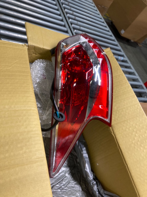 Photo 2 of Dorman 1611713 Driver Side Tail Lamp Assembly for Select Nissan Models