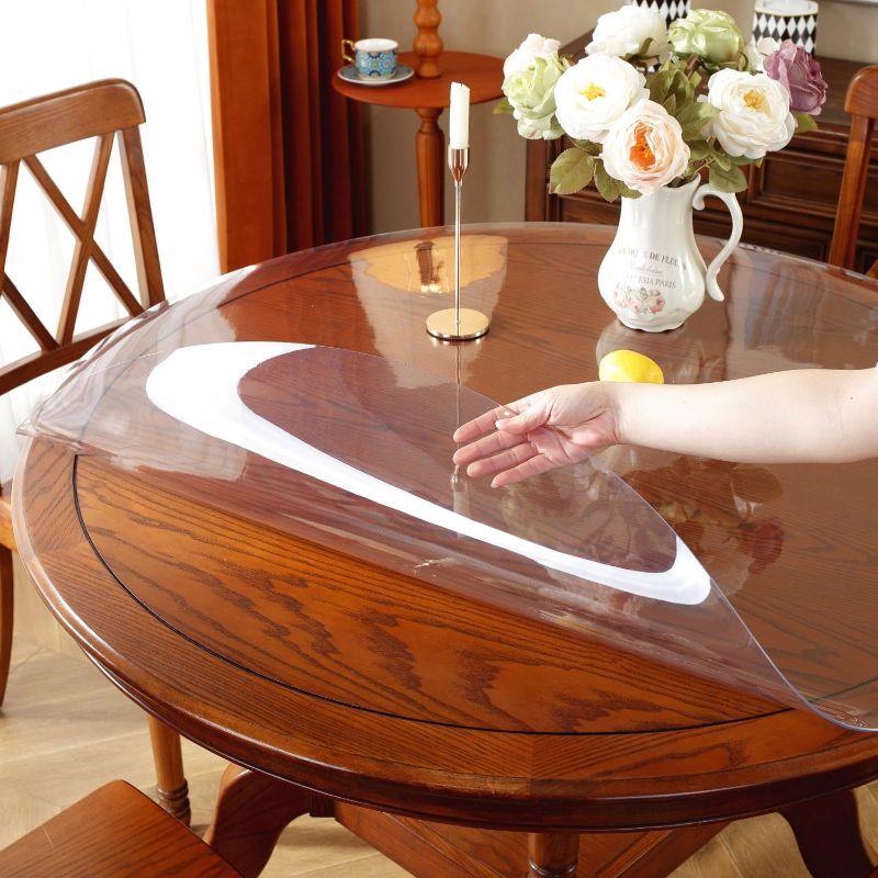 Photo 1 of ***USED**OstepDecor 2mm Thick 41 Inches Round Clear Table Protector, Clear Round Table Cover Protector, Round Table Top Protector, Round Plastic Table Protector for Dining Room Table, Round Plastic Table Cover Dia. 41 Inches Round Clear 2mm