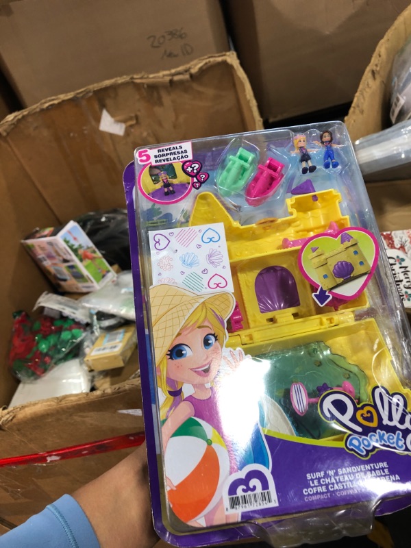 Photo 1 of Polly Pocket Travel Toy with 2 Micro Dolls, Dolphin Pet & Water Play Accessories, Pocket World Surf ‘N’ Sandventure Playset