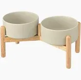 Photo 1 of 15° Slanted Ceramic Dog and Cat Bowl with Wooden Stand, Tilted Bulldog Food and Water Bowl No Slip Non-Spill for Cats Medium Dogs Big Face Pets 28.7 OZ (3.6 Cups, Beige × 2)