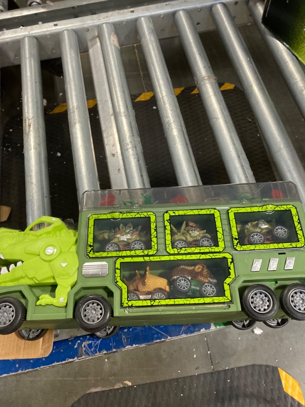 Photo 1 of Dreamon Dinosaur Transport Car Carrier Truck Toy,Dinosaur Toys for Kids 5-7,19 in 1 Dinosaur Truck with Light,Music & Roar Sound,Slide and Car Launcher,Christmas Birthday Gifts for Boys