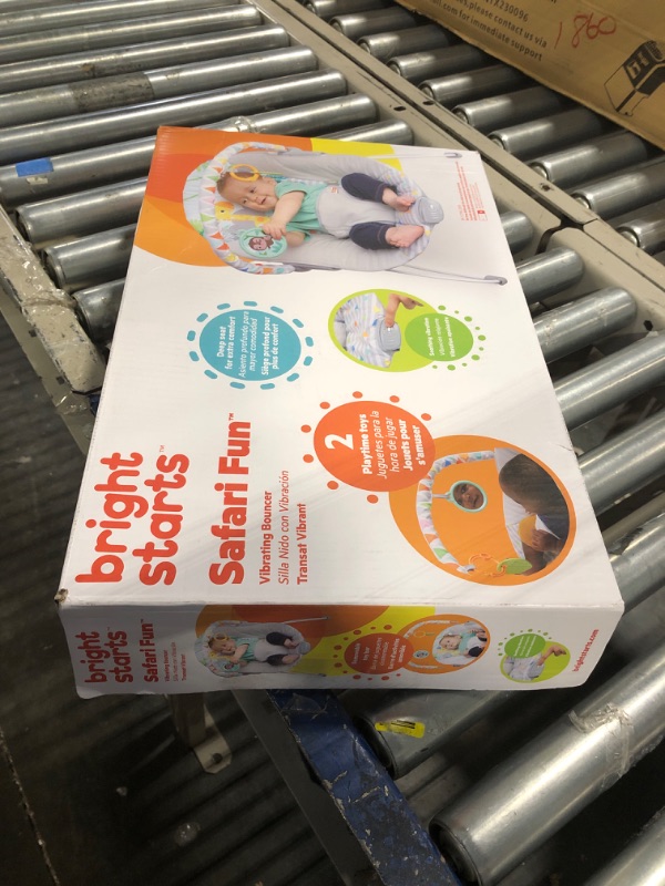 Photo 1 of Bright Starts Safari Fun 3-Point Harness Vibrating Baby Bouncer with Toy bar