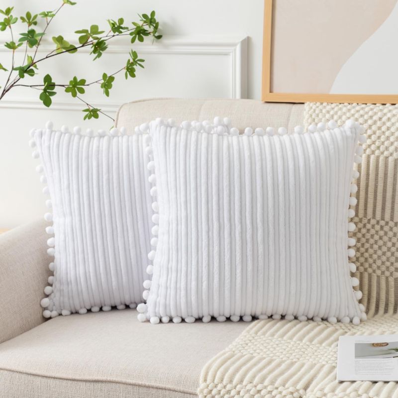 Photo 1 of UGASA Soft Boho Decorative Throw Pillow Covers with Pom-poms Pack of 2 Stripe Flannel Square Farmhouse Modern for Sofa Couch Bedroom Home Decor Gift, 18x18 Inch Pure White 