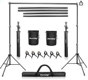 Photo 1 of Aureday Backdrop Stand, 10x7Ft Adjustable Photo Backdrop Stand Kit with 4 Crossbars, 6 Background Clamps, 2 Sandbags, and Carrying Bag for Parties/Wedding/Photography/Festival Decoration 