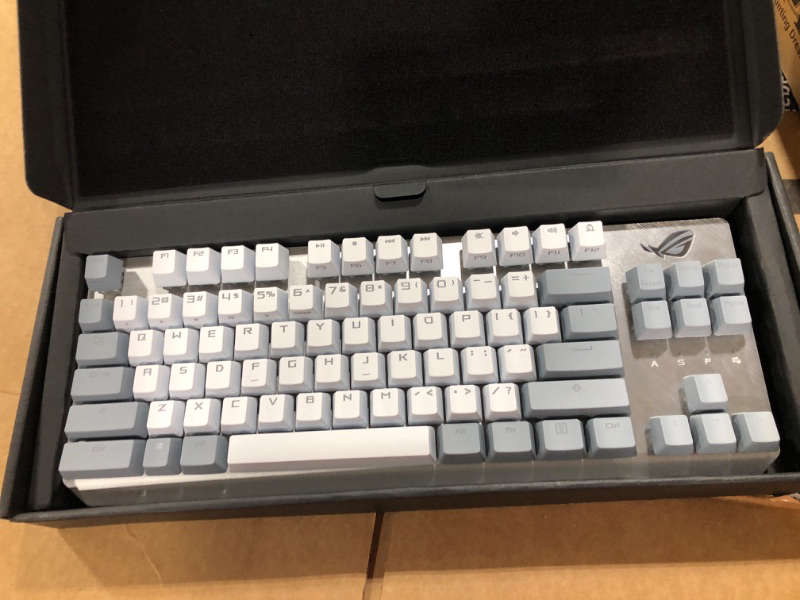 Photo 1 of ASUS WHITE AND GREY KEYBOARD / MISSING CABLE /SELLING FOR PART