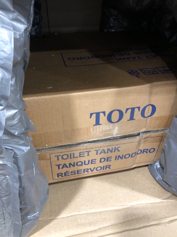 Photo 2 of TOTO Drake Two-Piece Elongated 1.6 GPF TORNADO FLUSH Toilet with CEFIONTECT, Cotton White - CST776CSG#01