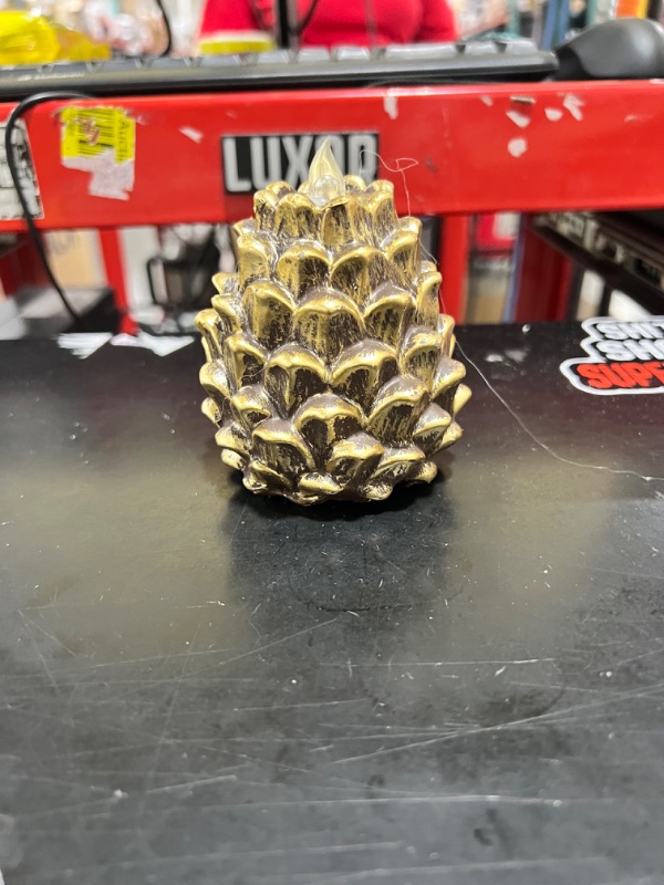 Photo 1 of Small gold flameless pinecone 