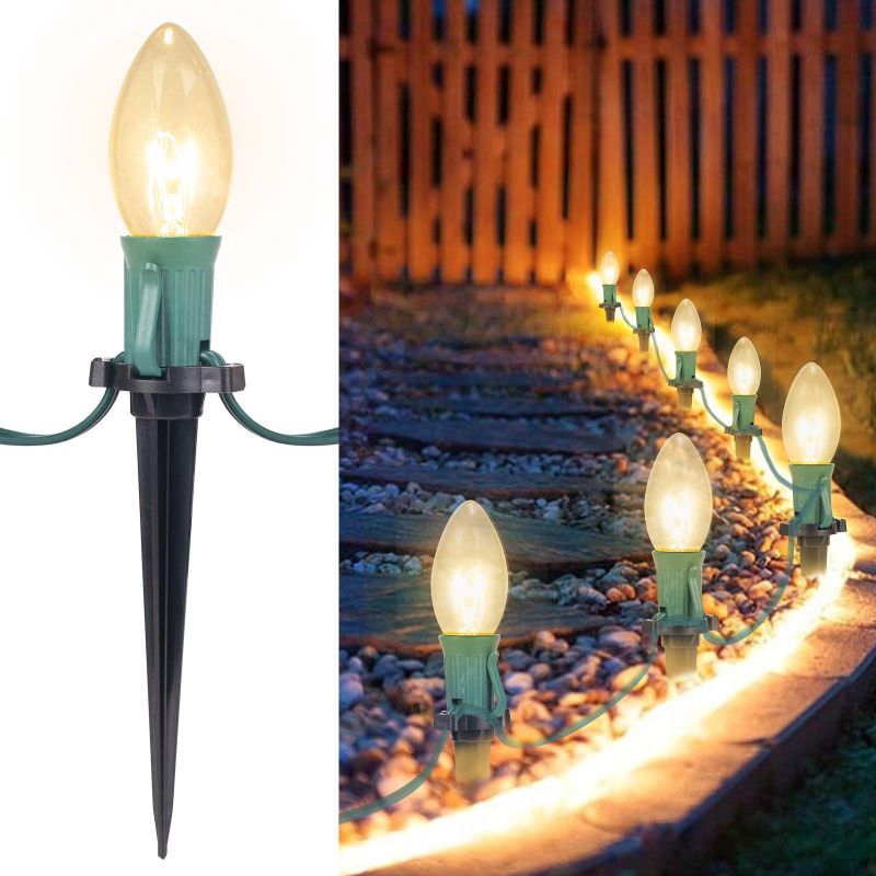 Photo 1 of Christmas Pathway String Lights Outdoor 25.7 Feet C9 20 Clear Lights Warm White with 20 Stakes Extendable Waterproof for Outdoor Walkway Lights Driveway Christmas Lights Use UL Listed 1 Pack