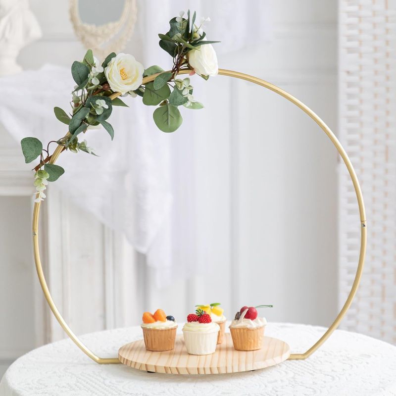 Photo 1 of GENMOUS Wedding Cake Stand with Wood Stand Base, Gold 20" Round Arch Cake Stand Set, Metal Floral Hoop Centerpiece Cake Stand for Table, Large Cake Display Stand for Party, Events, Birthday Reception
