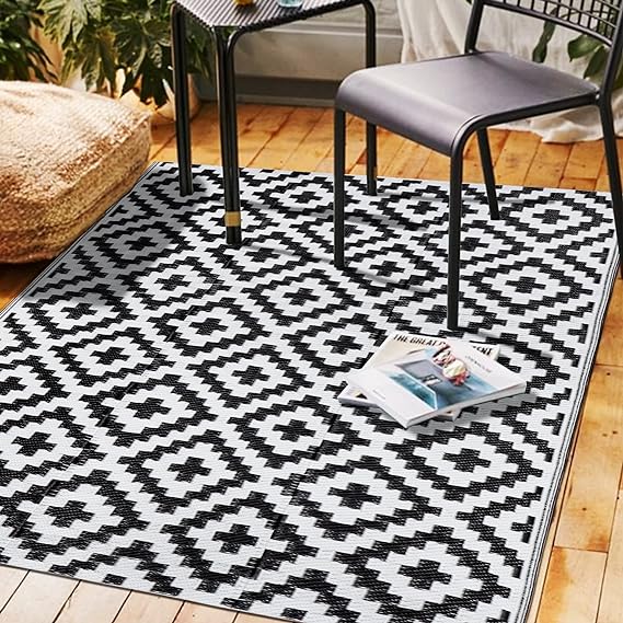 Photo 1 of SAND MINE Reversible Mats, Plastic Straw Rug, Modern Area Rug, Large Floor Mat and Rug for Outdoors, RV, Patio, Backyard, Deck, Picnic, Beach, Trailer, Camping (4' x 6', Black & White Lattice) 