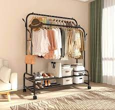 Photo 1 of Sturdy Metal Double Rodding Clothes Rack With Wheels, Portable Clothing Rack With Shelves & Hooks, Heavy Duty Garment Racks for Hanging Clothes, Multi-Functional Closet Rack for Bedroom, Black