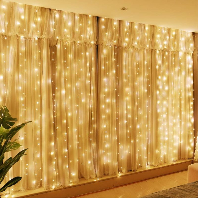 Photo 1 of HXWEIYE 300LED Fairy Curtain Lights, 9.8x9.8Ft Warm White USB Plug in 8 Modes Christmas String Hanging Lights with Remote for Bedroom, Indoor, Outdoor, Weddings, Party
