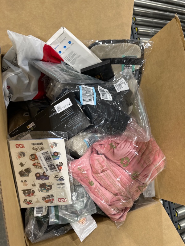 Photo 1 of Miscellaneous Box containing clothes of various styles and sizes, home goods, tech goods, Etc. Estimated value over $400, Sold as is, No returns