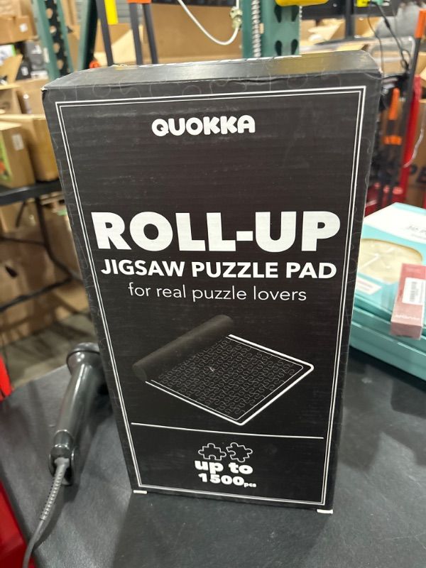 Photo 2 of QUOKKA Puzzle Mat Roll Up for Jigsaw Puzzles 1500 pcs | 46” x 26” Portable Grey Carbon Non-Slip Rubber Bottom with 3 mm Polyester Top | Storage Bag, Foam Tubes, 3 Hook & Loop Fastener Straps
