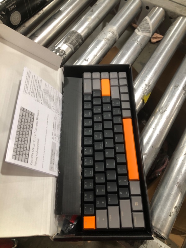 Photo 2 of Cherry MX-LP 2.1 Compact Wireless Gaming Keyboard. RGB MX Silver Speed Switches. RGB Lighting Low-Profile MX Precision switches. 65% Size. 68 Keys. (Black & Orange)
