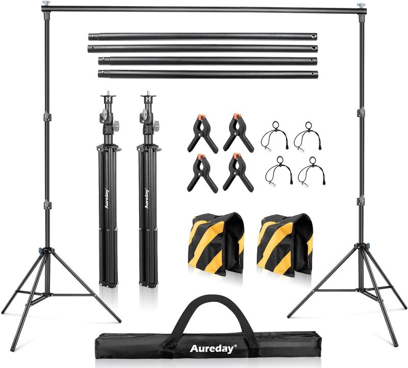 Photo 1 of Aureday Backdrop Stand, 10FT Adjustable Photo Backdrop Stand for Parties, Heavy Duty Background Stand with Travel Bag, 6 Backdrop Clamps, 4 Crossbars, 2 Sandbags for Wedding/Decorations/Photoshoot