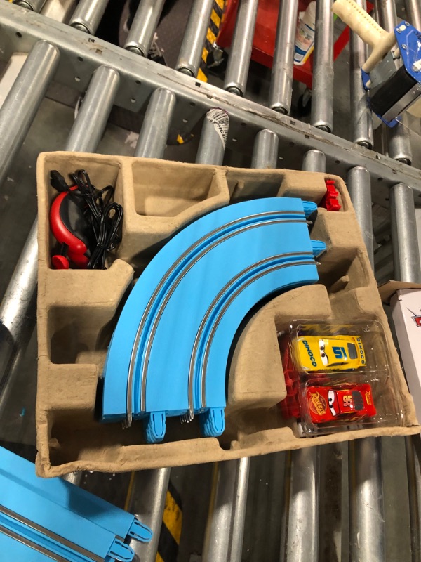 Photo 2 of Carrera First Disney/Pixar Cars - Slot Car Race Track - Includes 2 Cars: Lightning McQueen and Dinoco Cruz - Battery-Powered Beginner Racing Set for Kids Ages 3 Years and Up Disney Cars w/ Spinners