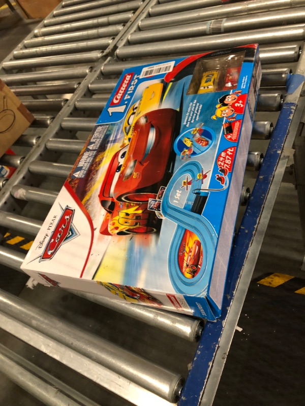 Photo 4 of Carrera First Disney/Pixar Cars - Slot Car Race Track - Includes 2 Cars: Lightning McQueen and Dinoco Cruz - Battery-Powered Beginner Racing Set for Kids Ages 3 Years and Up Disney Cars w/ Spinners