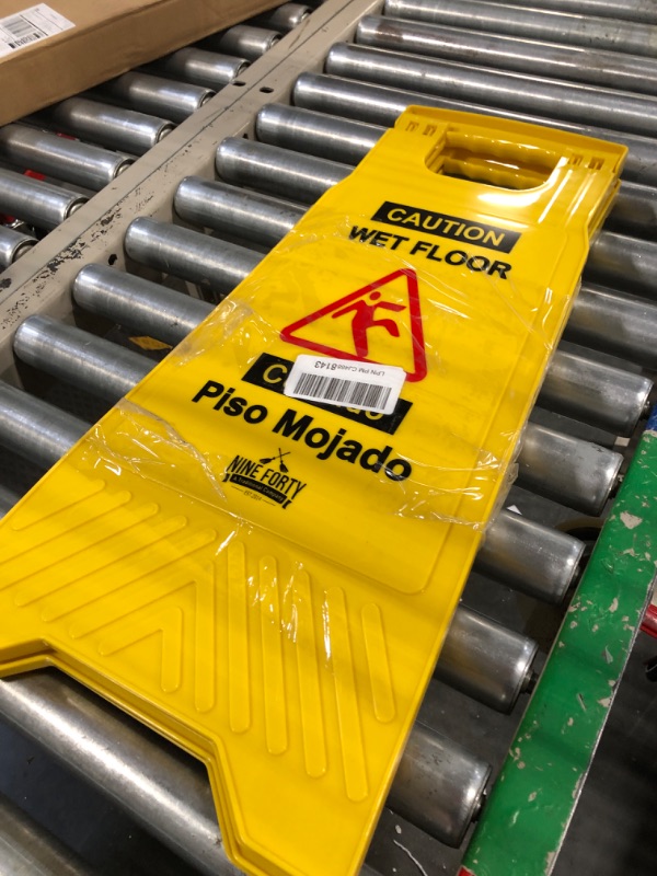 Photo 2 of Nine Forty No-Pinch Handle Commercial Caution Wet Floor Sign | Sturdy and Durable Yellow 2-Sided Fold-Out A-Frame Design | Bilingual Message - 24" Height | Ideal for Indoor and Outdoor Use | Pack of 2 2 pack