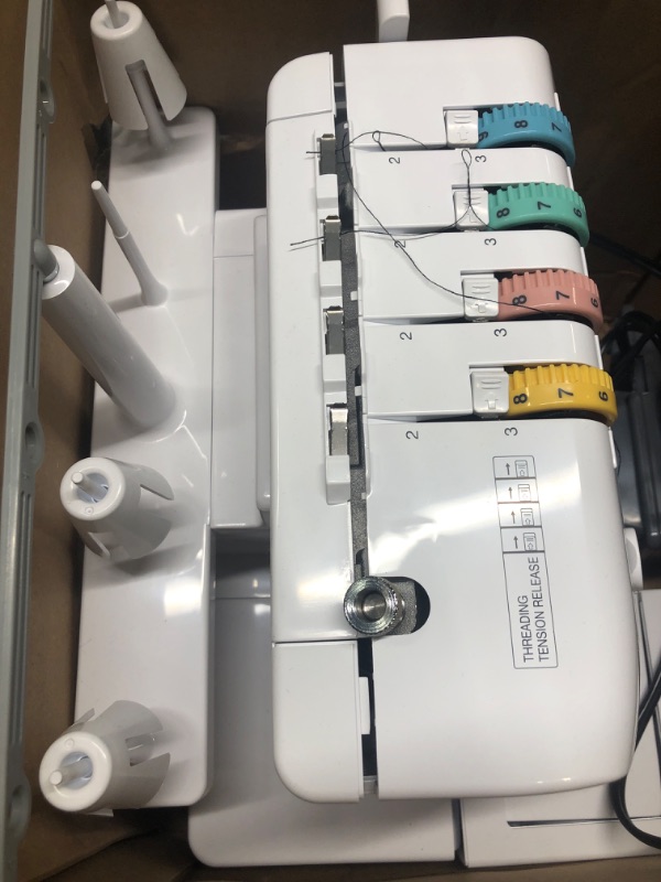 Photo 3 of **USED** Brother Serger, 1034D, Heavy-Duty Metal Frame Overlock Machine, 1,300 Stitches Per Minute, Removeable Trim Trap, 3 Included Accessory Feet,White