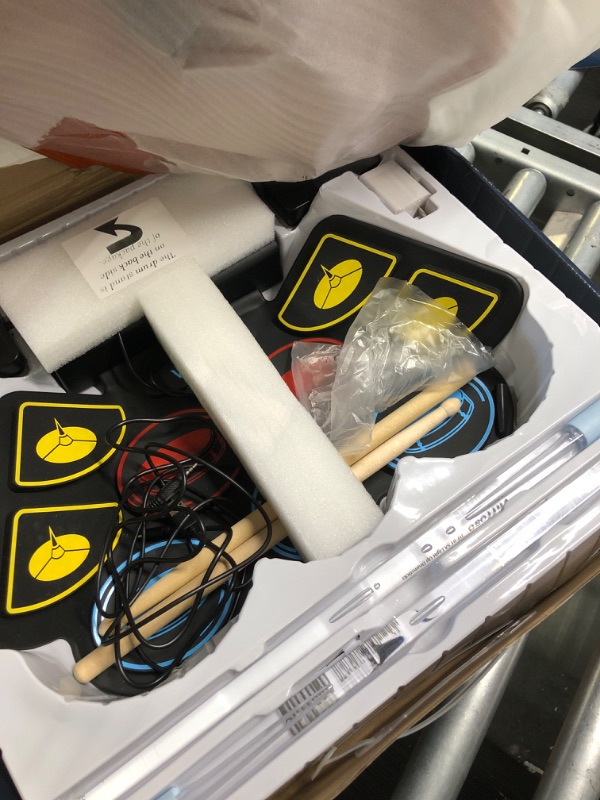 Photo 1 of **New OPen**(9 Pads) Electronic Drum Set with Light Up Drumsticks and Stand, Electronic Drum Pad with 5 Different Drum Kit, 10 Unique Rhythms, Bulit-in Double Speakers , Roll Up Drum Kit, Kids Drum Set Light Up Drumsticks + Electronic Drum + Stand