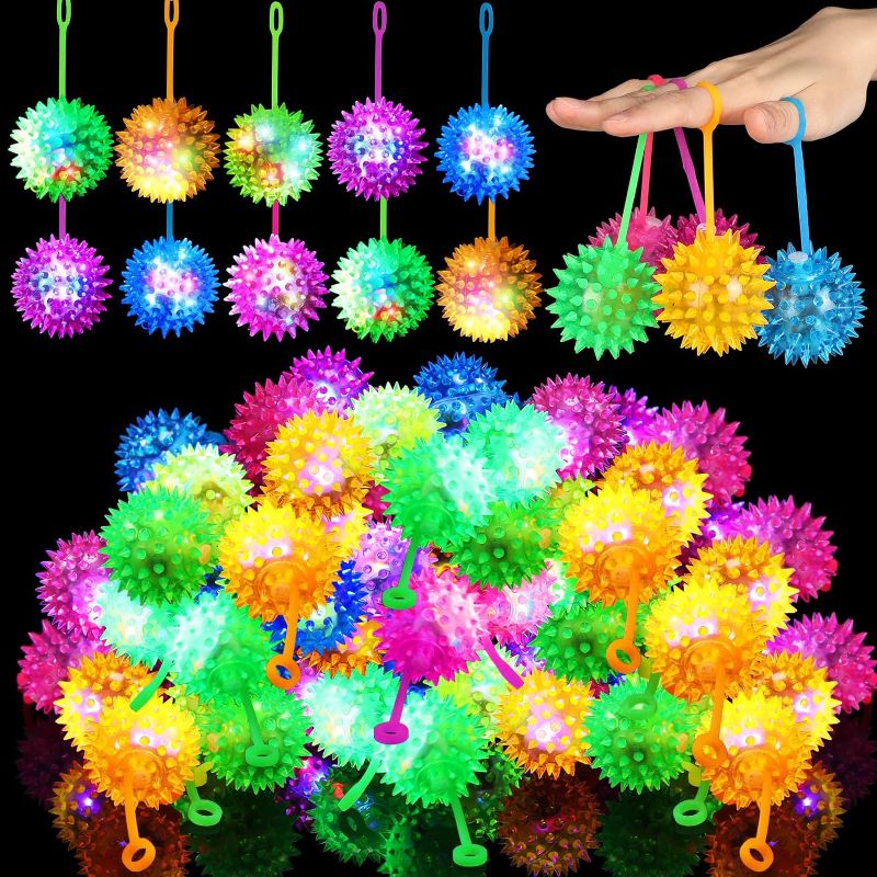 Photo 1 of 100 Pieces Light up LED Ball Spiky Bouncy Ball Flashing Squeaky Ball Multicolor Puffer Balls Stress Relief Balls Rubber Sensory Toy Carnival Prizes Bulk Party Favors for Kids, Teens, Adults
